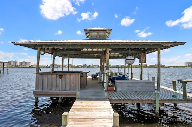 dock area with a water view and boat lift