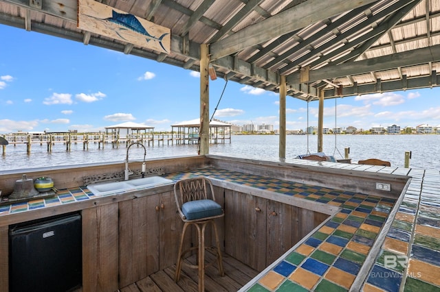 exterior space featuring a sink and a water view