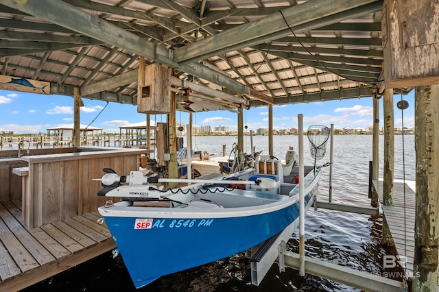 view of dock with a water view and boat lift