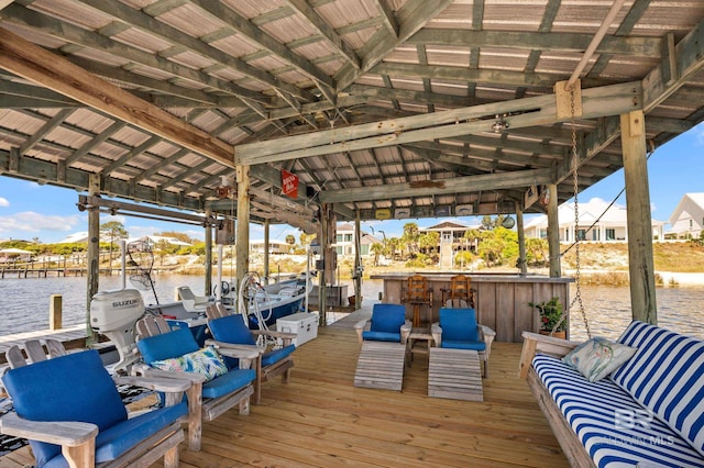 dock area with boat lift and a water view