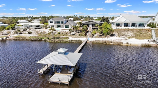 dock area featuring a residential view, a water view, and boat lift