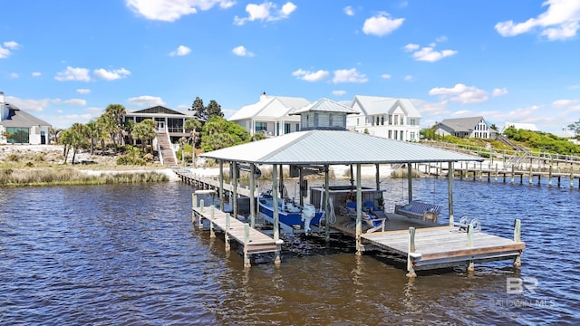 dock area featuring boat lift and a water view