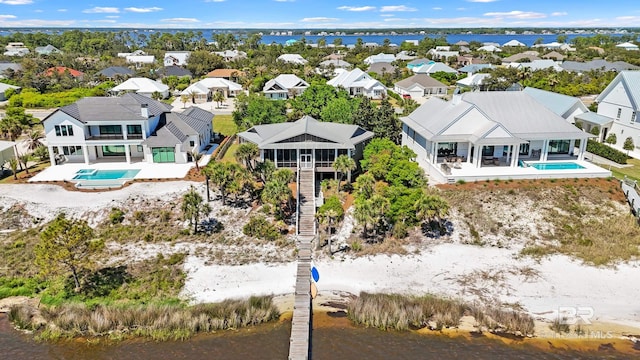 aerial view featuring a residential view and a water view