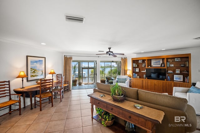 living room featuring visible vents, recessed lighting, ceiling fan, crown molding, and light tile patterned floors