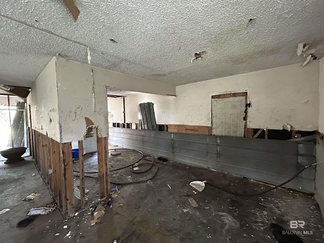 miscellaneous room with a textured ceiling