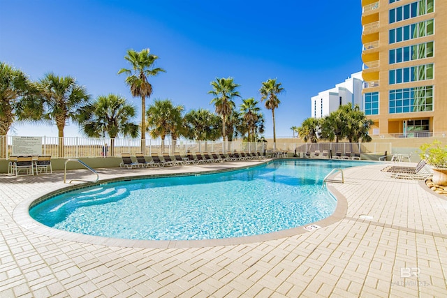 view of swimming pool featuring a patio area