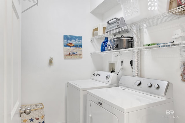 washroom with washer and dryer