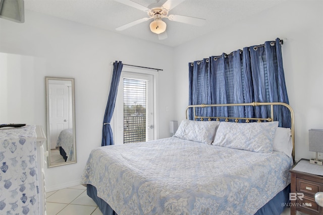 tiled bedroom with ceiling fan