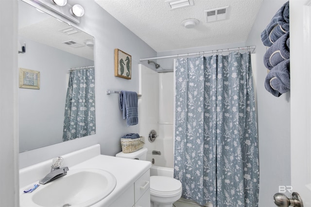 full bathroom featuring vanity, a textured ceiling, shower / bath combo, and toilet