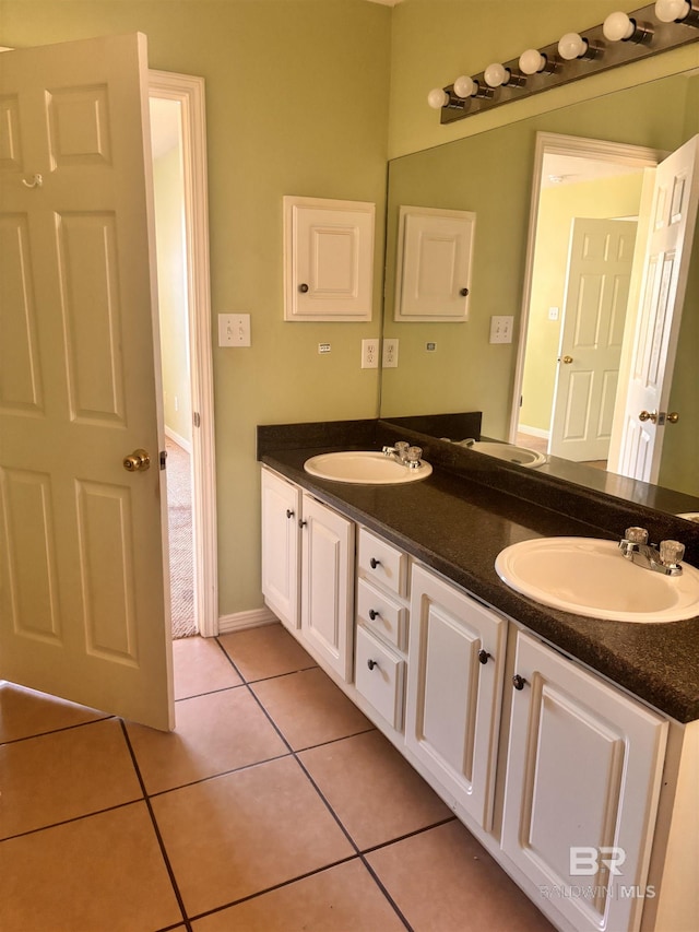 full bathroom with a sink, tile patterned floors, and double vanity