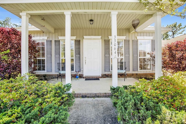 property entrance with covered porch