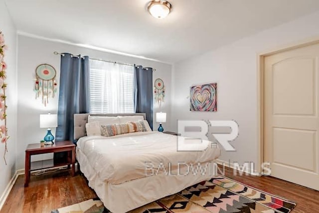 bedroom featuring dark hardwood / wood-style floors