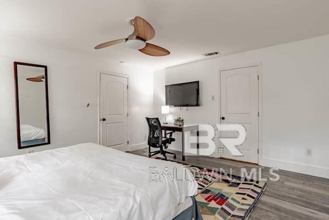 bedroom featuring hardwood / wood-style floors and ceiling fan