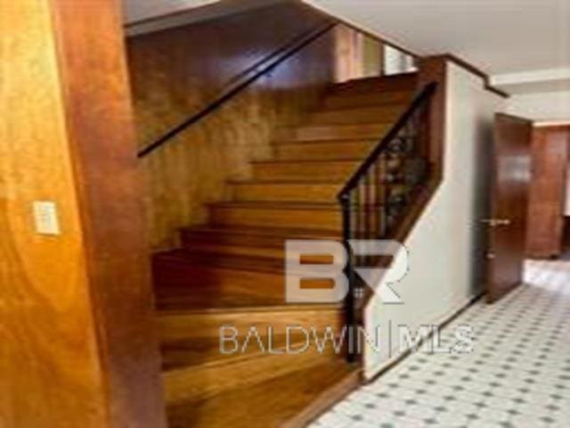 stairway with wooden walls