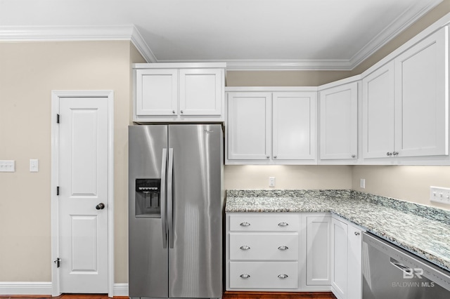 kitchen featuring white cabinetry, stainless steel appliances, and ornamental molding