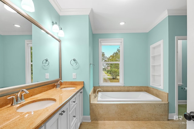 bathroom with a sink, ornamental molding, double vanity, and a bath