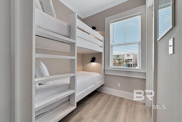 951 W Lagoon Ave, Gulf Shores, AL 36542 - bedroom with wood finished floors and baseboards