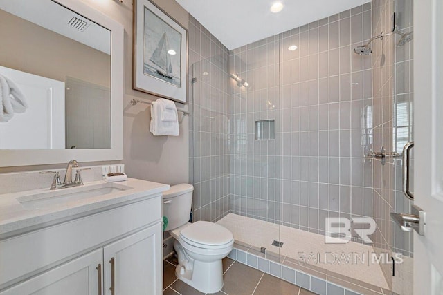 951 W Lagoon Ave, Gulf Shores, AL 36542 - bathroom featuring a tile shower, tile patterned floors, vanity, and recessed lighting