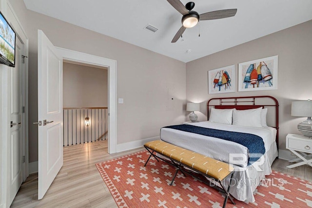 951 W Lagoon Ave, Gulf Shores, AL 36542 - bedroom with light wood-style floors and a ceiling fan