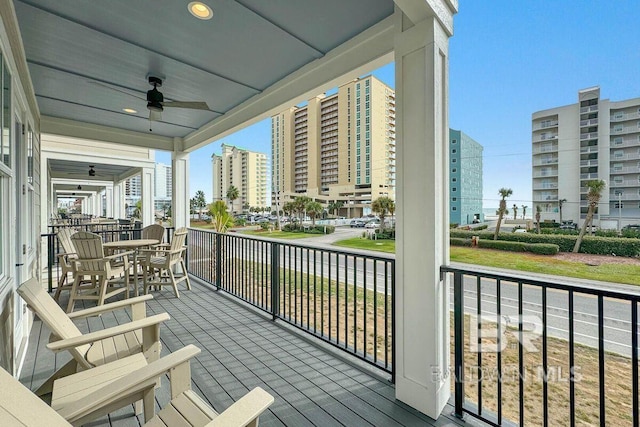 951 W Lagoon Ave, Gulf Shores, AL 36542 - wooden terrace with ceiling fan and outdoor dining space