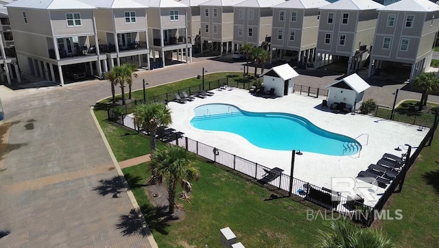 951 W Lagoon Ave, Gulf Shores, AL 36542 - community pool featuring a residential view and a patio