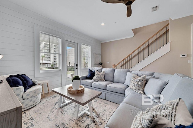 951 W Lagoon Ave, Gulf Shores, AL 36542 - living area featuring stairs, wood finished floors, a ceiling fan, and crown molding