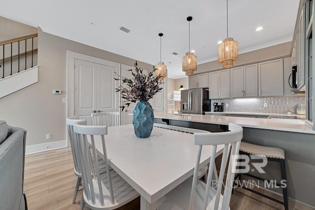 951 W Lagoon Ave, Gulf Shores, AL 36542 - dining room with light wood finished floors and recessed lighting