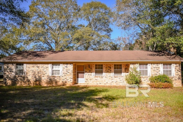 ranch-style house with a front lawn