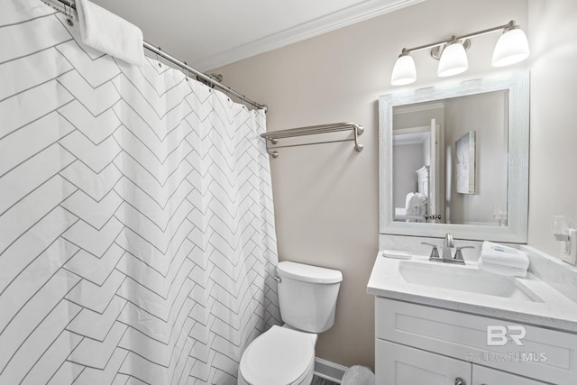bathroom with vanity, ornamental molding, walk in shower, and toilet