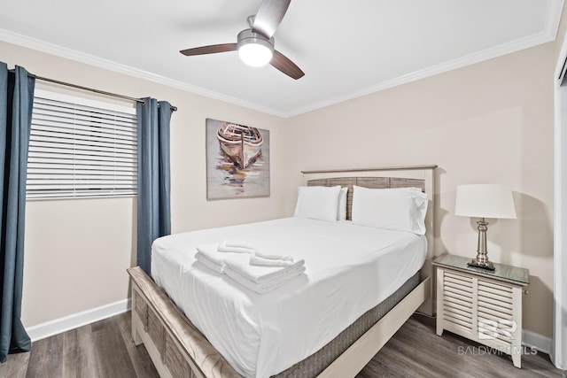 bedroom with crown molding, dark wood-type flooring, and ceiling fan