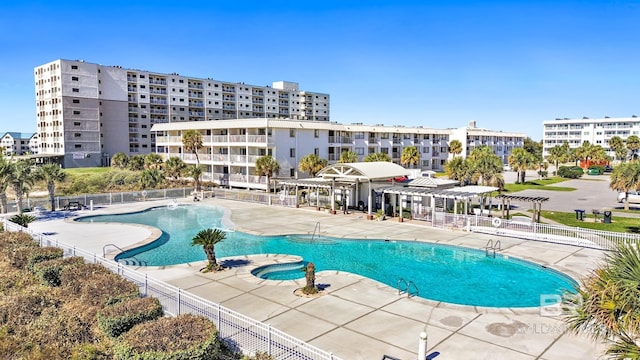 view of swimming pool featuring a pergola, a patio area, and a jacuzzi