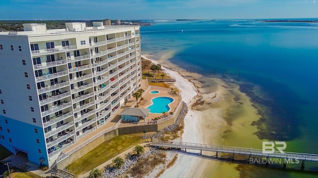 aerial view with a water view and a view of the beach