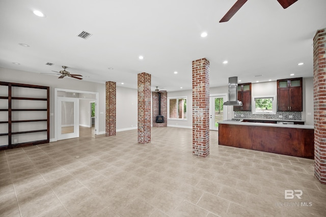 15031 Timber Ridge Dr, Loxley, AL 36551 - unfurnished living room featuring ornate columns, a ceiling fan, and recessed lighting