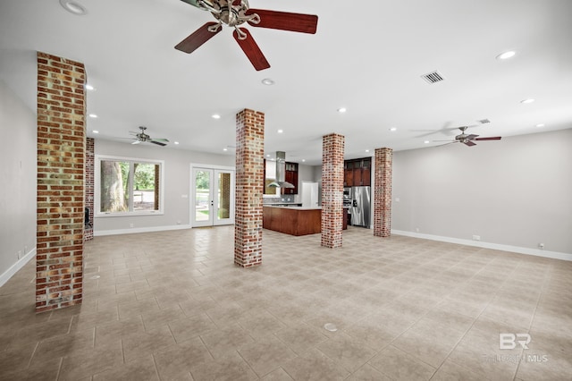 15031 Timber Ridge Dr, Loxley, AL 36551 - unfurnished living room with decorative columns, recessed lighting, visible vents, and a ceiling fan