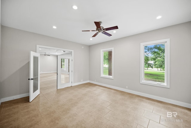 15031 Timber Ridge Dr, Loxley, AL 36551 - unfurnished bedroom with light tile patterned floors, baseboards, a ceiling fan, recessed lighting, and french doors