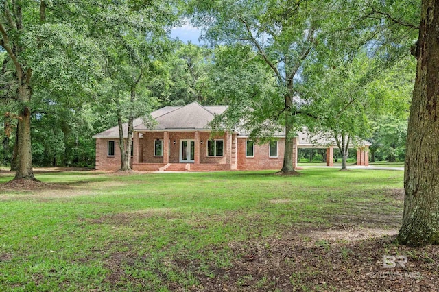 15031 Timber Ridge Dr, Loxley, AL 36551 - view of front of home featuring a carport, french doors, a front lawn, and brick siding