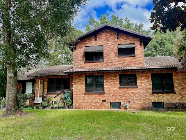 531 W Laurel Ave, Foley, AL 36535 - back of property with a lawn, brick siding, and a tile roof