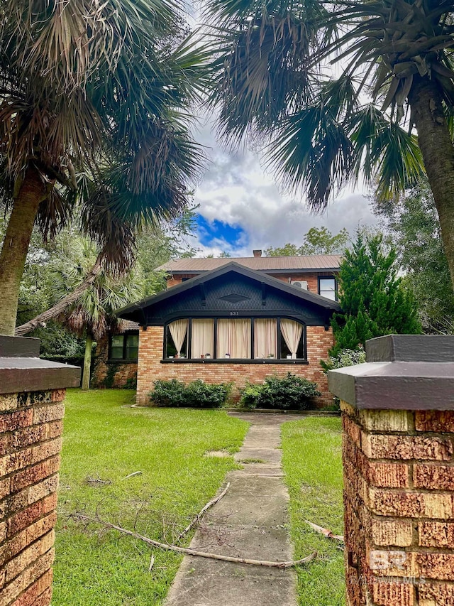531 W Laurel Ave, Foley, AL 36535 - view of front of property with a front yard and brick siding
