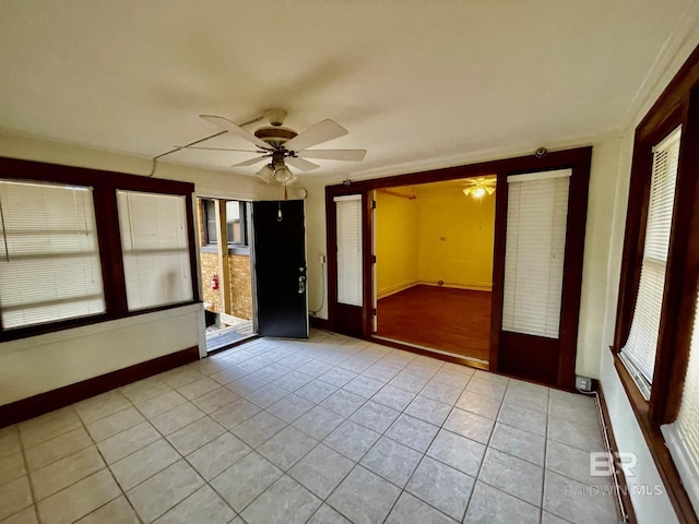 531 W Laurel Ave, Foley, AL 36535 - empty room featuring a ceiling fan, light tile patterned flooring, and baseboards