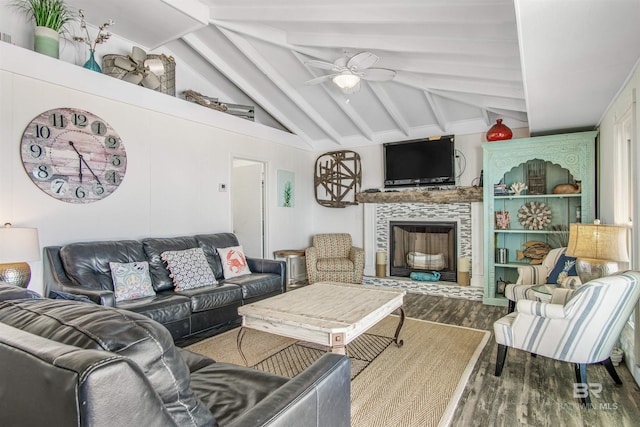 2816 Ponce De Leon Ct, Gulf Shores, AL 36542 - living area with a tiled fireplace, ceiling fan, vaulted ceiling with beams, and wood finished floors
