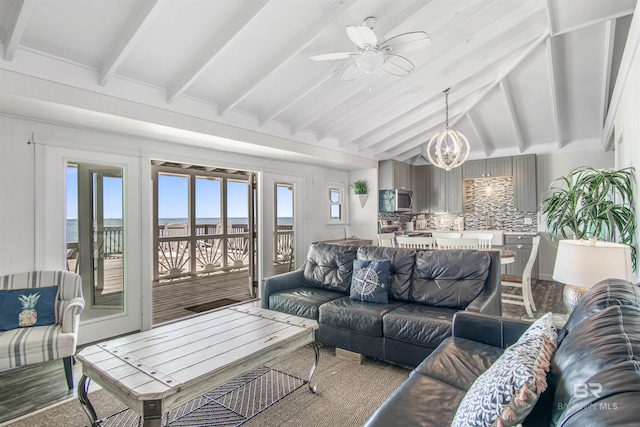 2816 Ponce De Leon Ct, Gulf Shores, AL 36542 - living area featuring lofted ceiling with beams and ceiling fan with notable chandelier