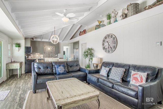 2816 Ponce De Leon Ct, Gulf Shores, AL 36542 - living area with ceiling fan with notable chandelier, light wood finished floors, and vaulted ceiling with beams