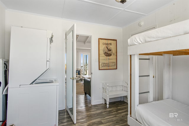 2816 Ponce De Leon Ct, Gulf Shores, AL 36542 - bedroom featuring dark wood-style floors, stacked washer / dryer, and crown molding
