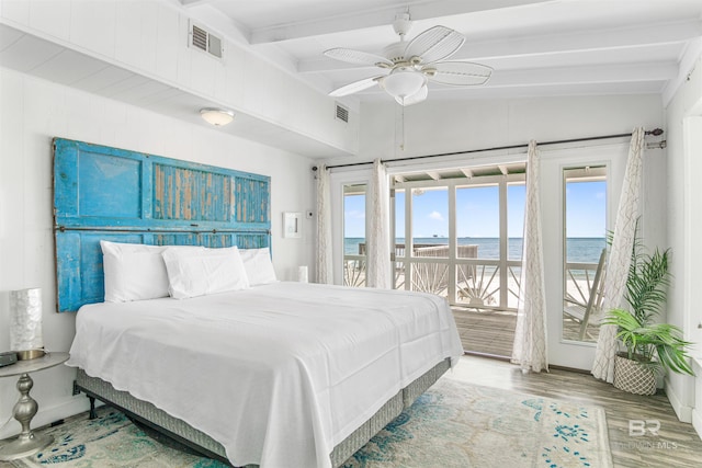 2816 Ponce De Leon Ct, Gulf Shores, AL 36542 - bedroom with access to exterior, wood finished floors, lofted ceiling with beams, and visible vents