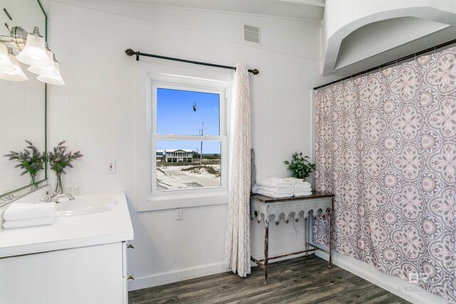 2816 Ponce De Leon Ct, Gulf Shores, AL 36542 - interior space featuring baseboards, a sink, dark wood-style floors, and visible vents