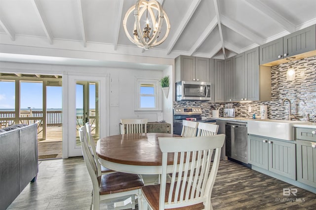 2816 Ponce De Leon Ct, Gulf Shores, AL 36542 - dining room with dark wood-type flooring, lofted ceiling with beams, and a notable chandelier