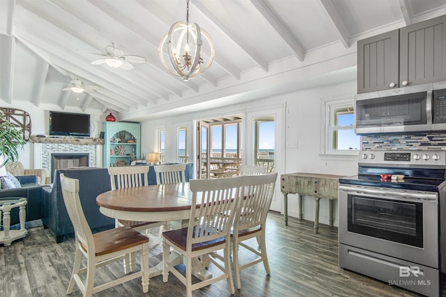 2816 Ponce De Leon Ct, Gulf Shores, AL 36542 - dining area featuring a fireplace, vaulted ceiling with beams, wood finished floors, and ceiling fan with notable chandelier