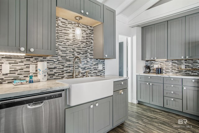 2816 Ponce De Leon Ct, Gulf Shores, AL 36542 - kitchen featuring stainless steel dishwasher, vaulted ceiling, a sink, and gray cabinets