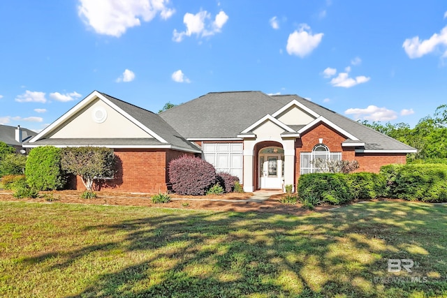 ranch-style home with brick siding and a front yard
