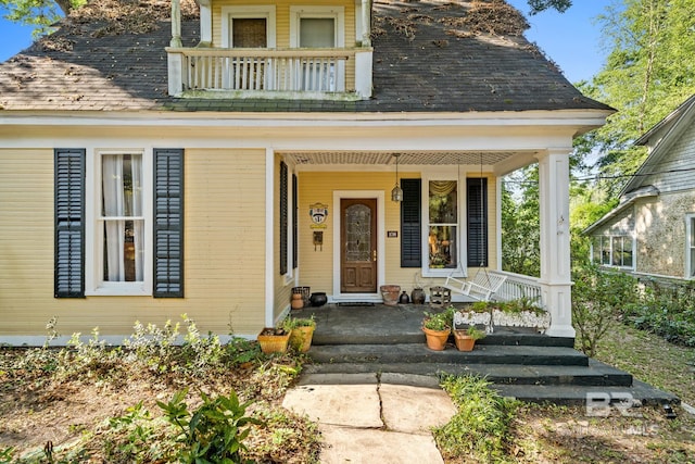 property entrance featuring covered porch